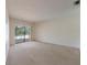 Gathering room with sliding doors leading to a view of the pool at 4726 Windflower Cir, Tampa, FL 33624