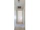 Clean hallway with carpeted floor and access to bedrooms at 4726 Windflower Cir, Tampa, FL 33624
