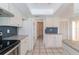 White kitchen cabinets, granite counters, and stainless steel appliances at 4726 Windflower Cir, Tampa, FL 33624