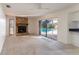 Living room features a stone fireplace and pool view at 4726 Windflower Cir, Tampa, FL 33624