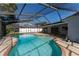 Relaxing kidney shaped pool with screened enclosure at 4726 Windflower Cir, Tampa, FL 33624