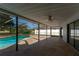 Spacious covered patio with pool and fenced backyard views at 4726 Windflower Cir, Tampa, FL 33624