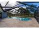 Inviting screened pool area, perfect for relaxation at 4726 Windflower Cir, Tampa, FL 33624