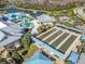 Wonderful aerial view of the community pool, bocce ball court, and manicured green spaces at 4748 Ballast Crest Cv, Land O Lakes, FL 34638