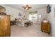 Bright bedroom showcasing a decorative bed, bench, and bedside tables, with a large window at 4748 Ballast Crest Cv, Land O Lakes, FL 34638