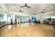 Spacious fitness studio with hardwood floors, mirrors, and equipment for yoga, Pilates, and other group fitness classes at 4748 Ballast Crest Cv, Land O Lakes, FL 34638