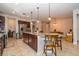 Open-concept kitchen with granite counters, a central island, and stainless steel appliances at 4748 Ballast Crest Cv, Land O Lakes, FL 34638