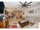 Open-concept living space with modern furnishings, seamlessly connecting to the kitchen and dining area at 4748 Ballast Crest Cv, Land O Lakes, FL 34638
