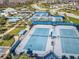 Aerial view of the community tennis courts with shade coverings and lush landscaping at 4748 Ballast Crest Cv, Land O Lakes, FL 34638