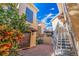 Inviting entryway with a metal staircase and terracotta tile floors at 487 Pinellas Bayway S # 205, St Petersburg, FL 33715