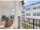 Private balcony with wicker chairs and views of the community at 5351 Bridge St # 67, Tampa, FL 33611