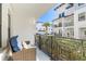 Relaxing balcony with wicker furniture, offering a view of the community at 5351 Bridge St # 67, Tampa, FL 33611
