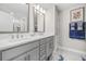 Modern bathroom with double vanity and walk-in shower at 5351 Bridge St # 67, Tampa, FL 33611