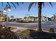 Evening view of community roundabout with palm trees and shops at 5351 Bridge St # 67, Tampa, FL 33611