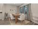 Inviting dining area with natural light and neutral decor and seating for six at 5351 Bridge St # 67, Tampa, FL 33611