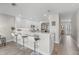 Modern kitchen with white cabinets, stainless steel appliances, and an island at 5351 Bridge St # 67, Tampa, FL 33611