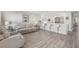 Bright, open-concept living room flowing into a kitchen with breakfast bar seating at 5351 Bridge St # 67, Tampa, FL 33611