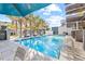 Inviting pool area with comfortable seating and umbrellas at 5351 Bridge St # 67, Tampa, FL 33611