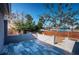 Outdoor patio with gray pavers and gray perimeter walls with a wooden privacy fence at 5405 Golden Nugget Dr, Holiday, FL 34690