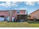 Private screened patio and grassy backyard at 7069 Towne Lake Rd, Riverview, FL 33578