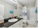 Bathroom with granite countertop and shower/tub combo at 7069 Towne Lake Rd, Riverview, FL 33578