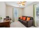 Bright bedroom with a couch and workspace at 7069 Towne Lake Rd, Riverview, FL 33578