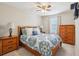 Primary bedroom with dresser and ensuite bathroom at 7069 Towne Lake Rd, Riverview, FL 33578