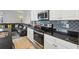 Modern kitchen with granite countertops and stainless steel appliances at 7069 Towne Lake Rd, Riverview, FL 33578