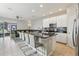 Modern kitchen with granite countertops and white cabinets at 7069 Towne Lake Rd, Riverview, FL 33578