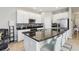 Modern kitchen with granite countertops and white cabinets at 7069 Towne Lake Rd, Riverview, FL 33578
