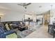Open living room and kitchen with a large sectional sofa at 7069 Towne Lake Rd, Riverview, FL 33578
