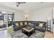 Open concept living room with sliding door to patio at 7069 Towne Lake Rd, Riverview, FL 33578