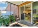 Cozy patio with sliding glass doors leading to the interior at 7069 Towne Lake Rd, Riverview, FL 33578