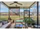 Covered patio with comfortable seating and view of backyard at 7069 Towne Lake Rd, Riverview, FL 33578