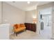 Upstairs sitting area with small sofa and storage cabinet at 7069 Towne Lake Rd, Riverview, FL 33578