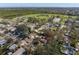 An aerial view of a neighborhood with a sports field and clear skies in the distance at 738 59Th Ne Ave, St Petersburg, FL 33703
