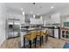 Modern kitchen with white cabinets, stainless steel appliances, and an island at 7715 S Obrien St, Tampa, FL 33616