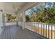 Screened porch overlooking backyard with treetop views at 7715 S Obrien St, Tampa, FL 33616