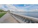 Scenic waterfront path with balustrade, offering captivating city skyline views at 7715 S Obrien St, Tampa, FL 33616