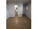 Bright bedroom with tile flooring and access to a bathroom at 8105 Tanglewood Ln, Tampa, FL 33615