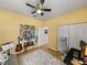 Bright bedroom with a guitar and work area at 8784 Ashworth Dr, Tampa, FL 33647