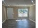 Living room with gray flooring and large window at 9387 Pinero St, Spring Hill, FL 34608