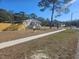 Side view of the house showing additional landscaping at 9387 Pinero St, Spring Hill, FL 34608