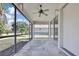 Relaxing screened porch with ceiling fan at 9813 Balsaridge Ct, Trinity, FL 34655