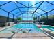 Inviting pool area with covered lanai, spa, and ample lounge space at 9919 Smarty Jones Dr, Ruskin, FL 33573