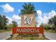 Mariposa community entrance sign with butterfly logo at 10641 Cardera Dr, Riverview, FL 33578