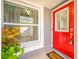 Red front door with white trim and window at 11045 Springridge Dr, Tampa, FL 33624