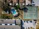 Aerial view of the community with a pool and tennis courts at 1137 King Arthur Ct # 510, Dunedin, FL 34698