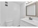 Clean bathroom with white vanity, modern faucet, and modern lighting at 1137 King Arthur Ct # 510, Dunedin, FL 34698