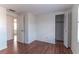 This bedroom has hardwood floors and two doors that open to adjoining rooms at 1137 King Arthur Ct # 510, Dunedin, FL 34698